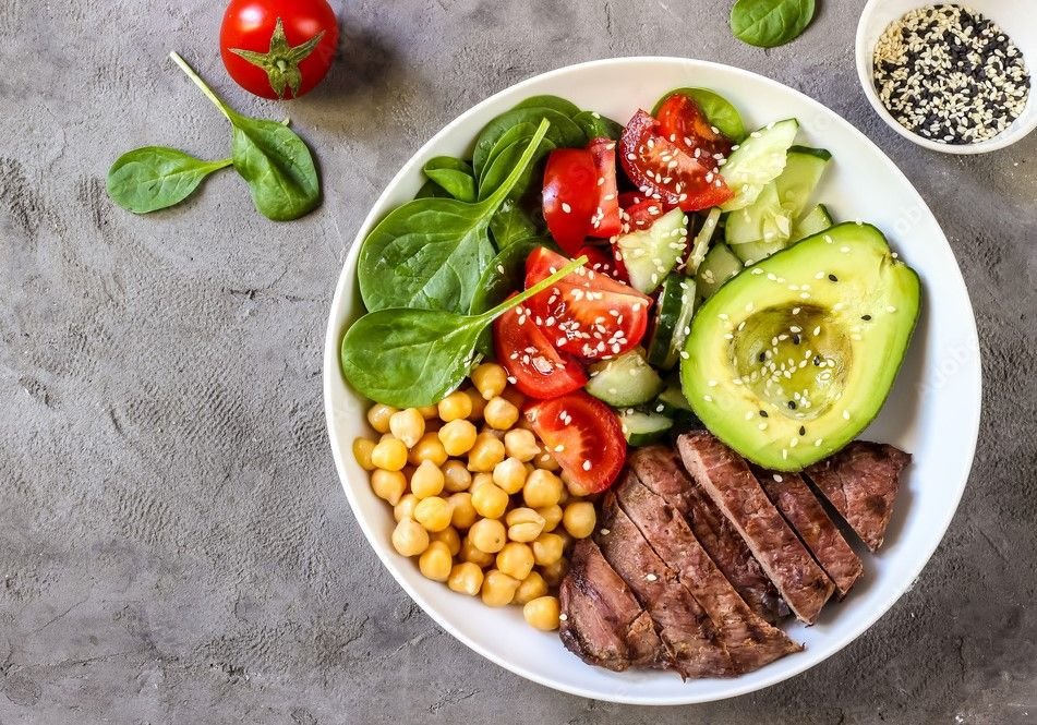 Colorful balanced plate with vegetables, grains, and protein arranged in harmonious portions